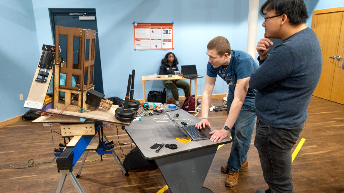 Sreang Hok/Cornell University Students Thomas Vignos ’26, left, and Francis Xie ’28 demonstrate new hardware projects at the Sciencenter.