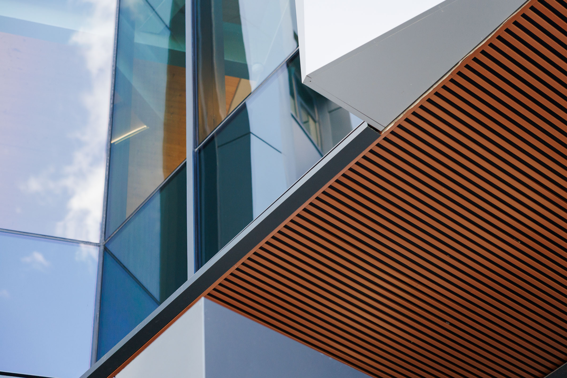 architecture sharp angles of a metal building with orange paneling