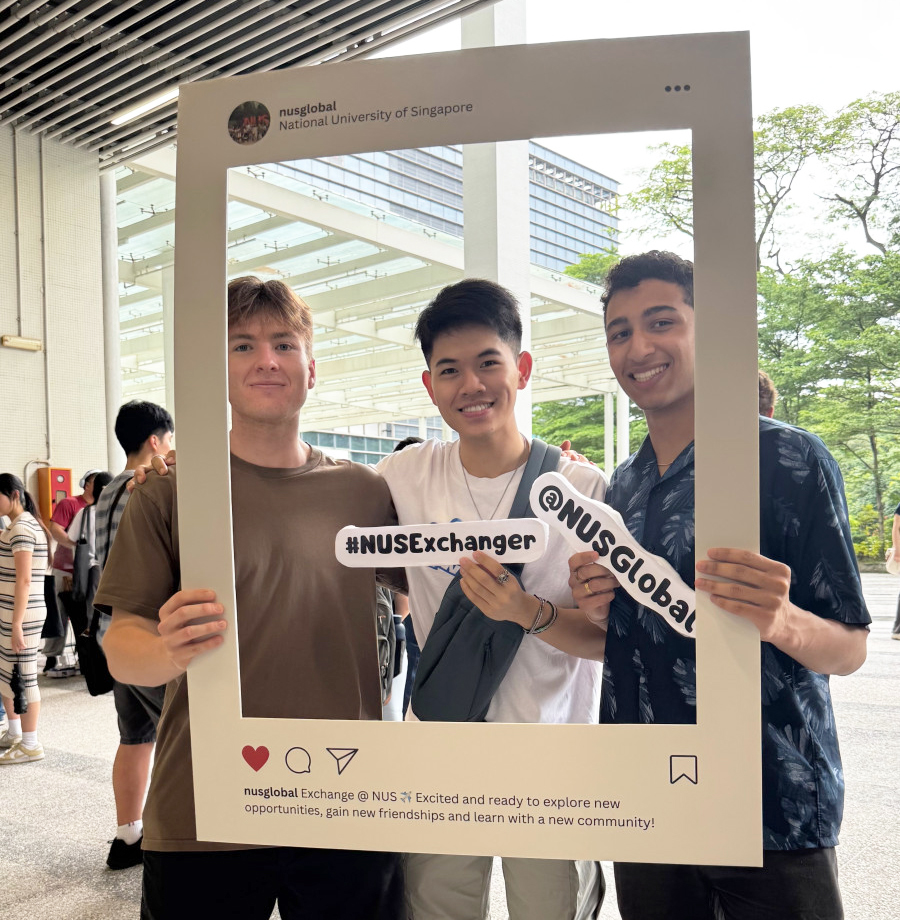 A color photo showing 3 men posing for a photo.