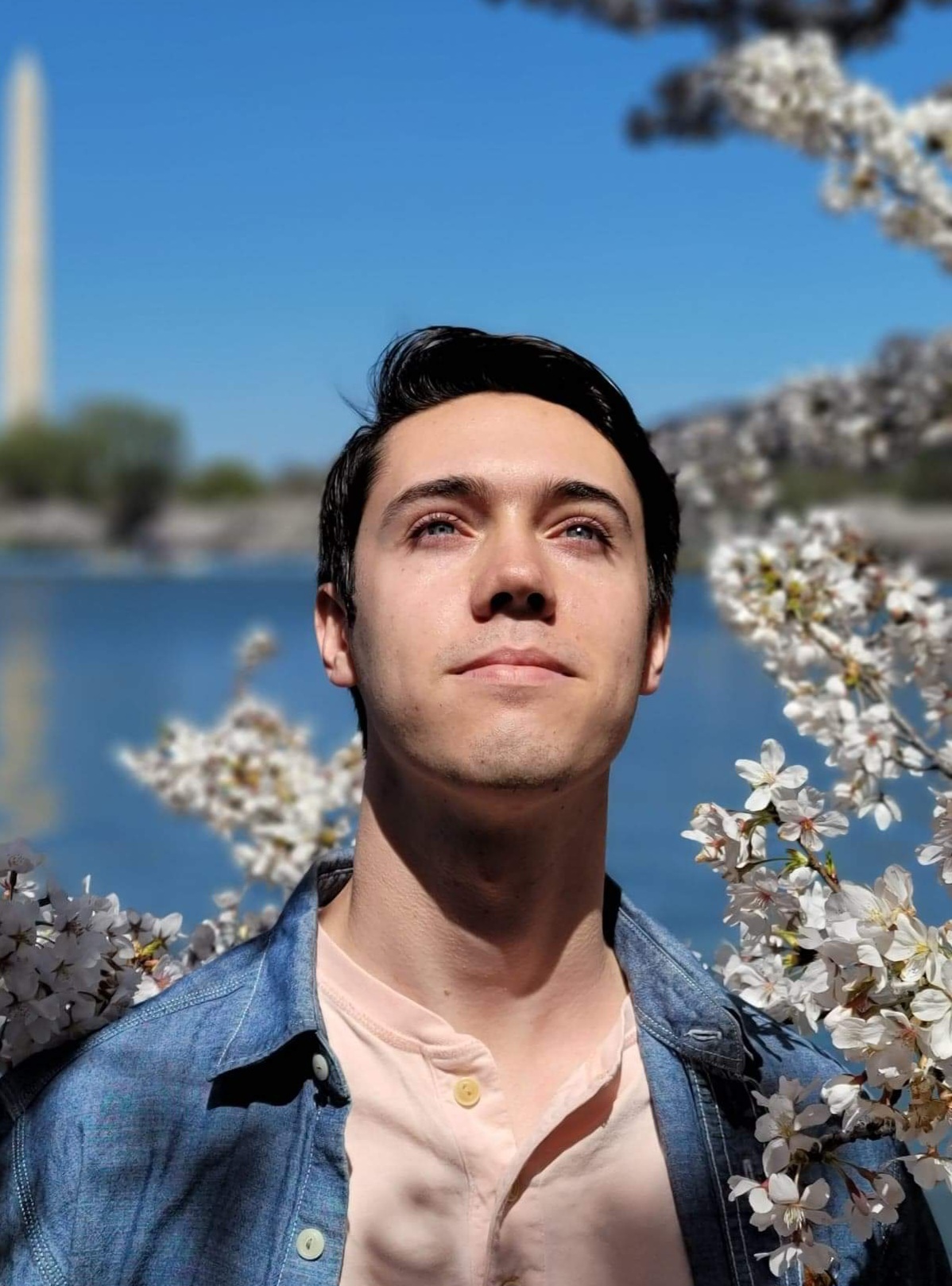 A color photo of a man smiling for a photo