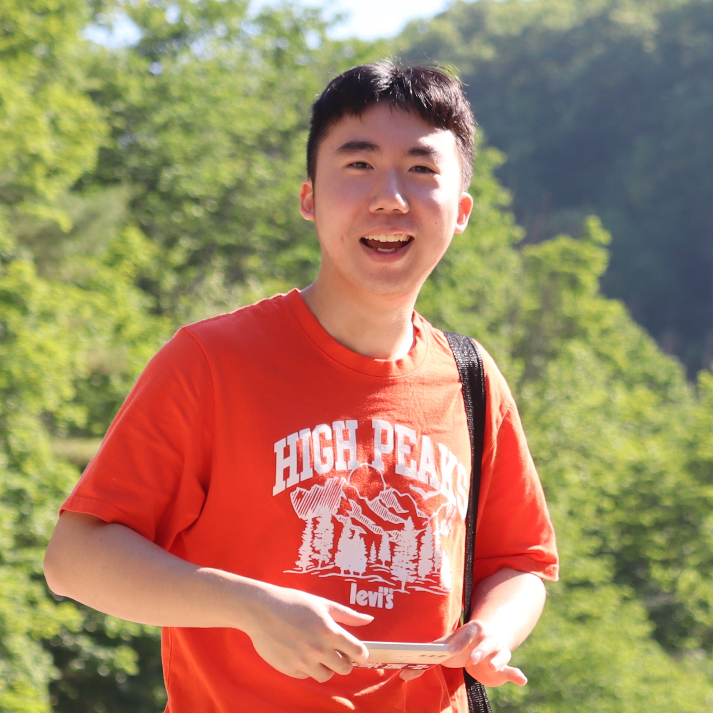 A color photo of a man smiling for a photo