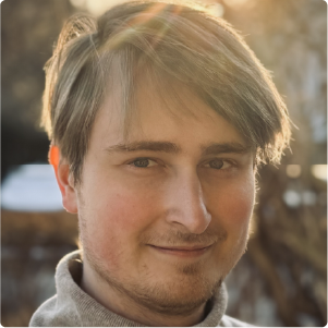 A color photo of a man at sunset.