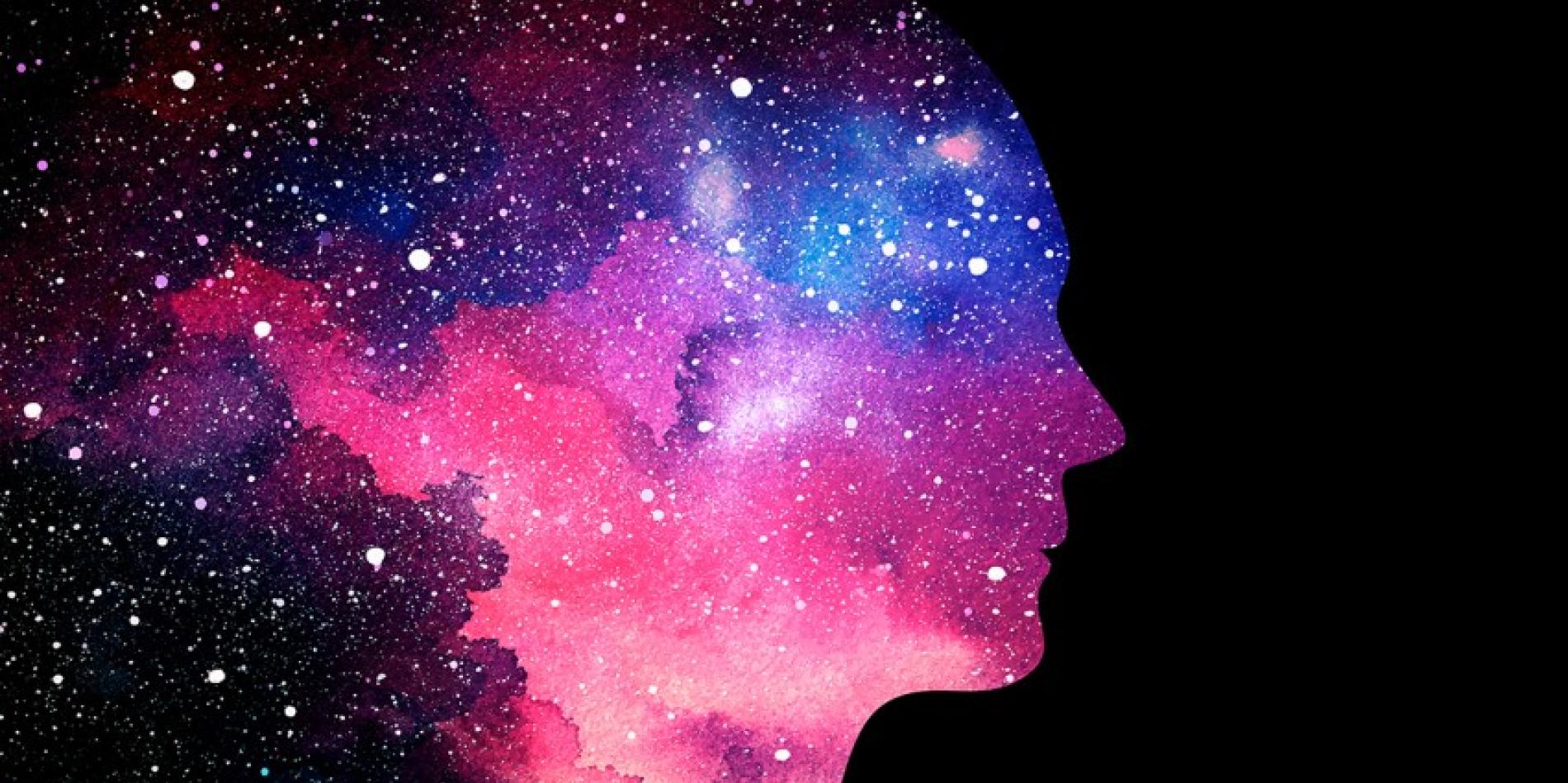 AI illustration of a profile of a human's face fading into a galaxy