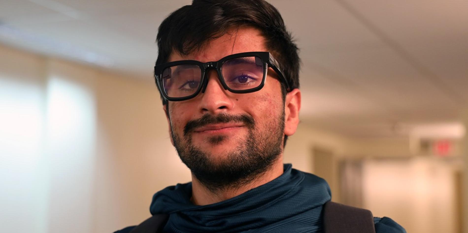 Nirbhay Narang ’25 wearing smart glasses he created that use AI to provide transcriptions of conversations in real time.