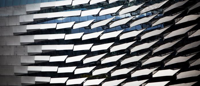 gray fins on the side of Gates Hall reflect light