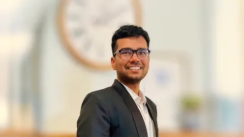 A color photo of Devansh Agarwal in front of a blurred background