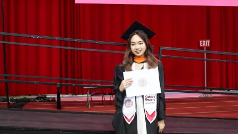 A color photo of a woman after graduation.