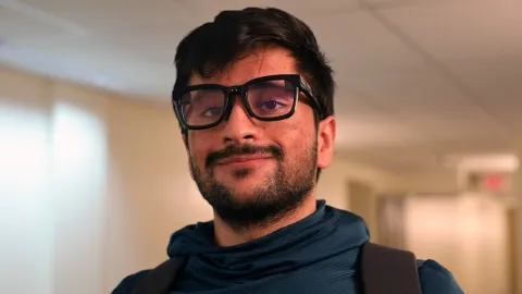 Nirbhay Narang ’25 wearing smart glasses he created that use AI to provide transcriptions of conversations in real time.