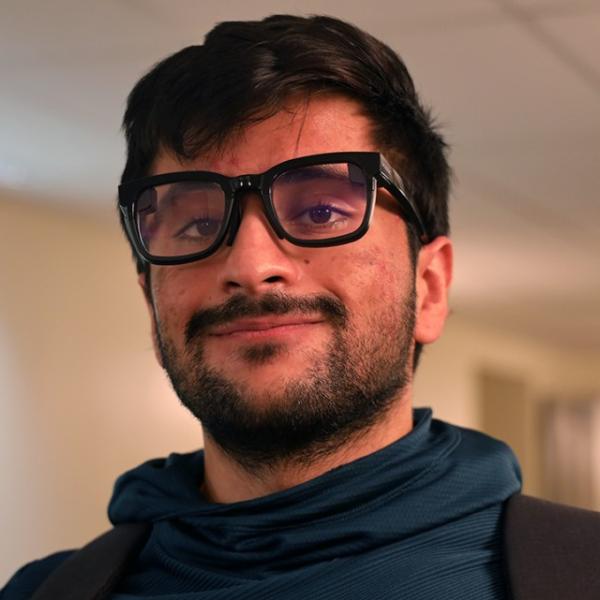 Nirbhay Narang ’25 wearing smart glasses he created that use AI to provide transcriptions of conversations in real time.