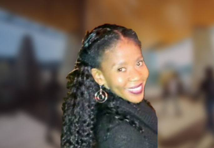 A color photo of Sharlane Cleare with a blurred background