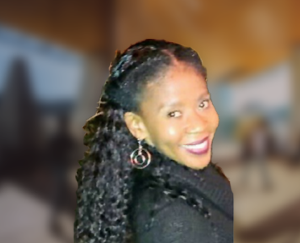 A color photo of Sharlane Cleare with a blurred background